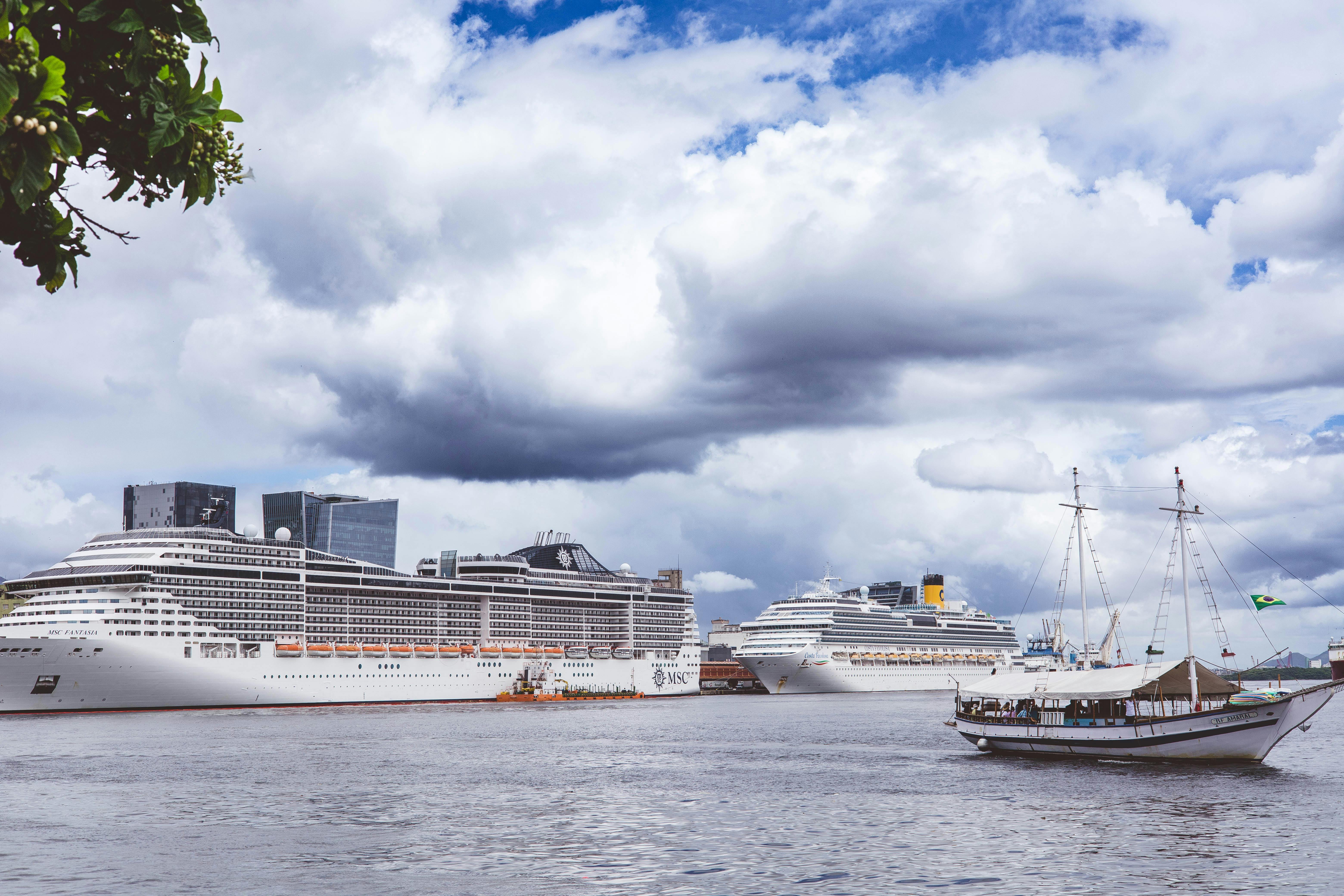 A large cruise ship docked at the historic Old San Juan piers near the colorful city center - transportation from san juan