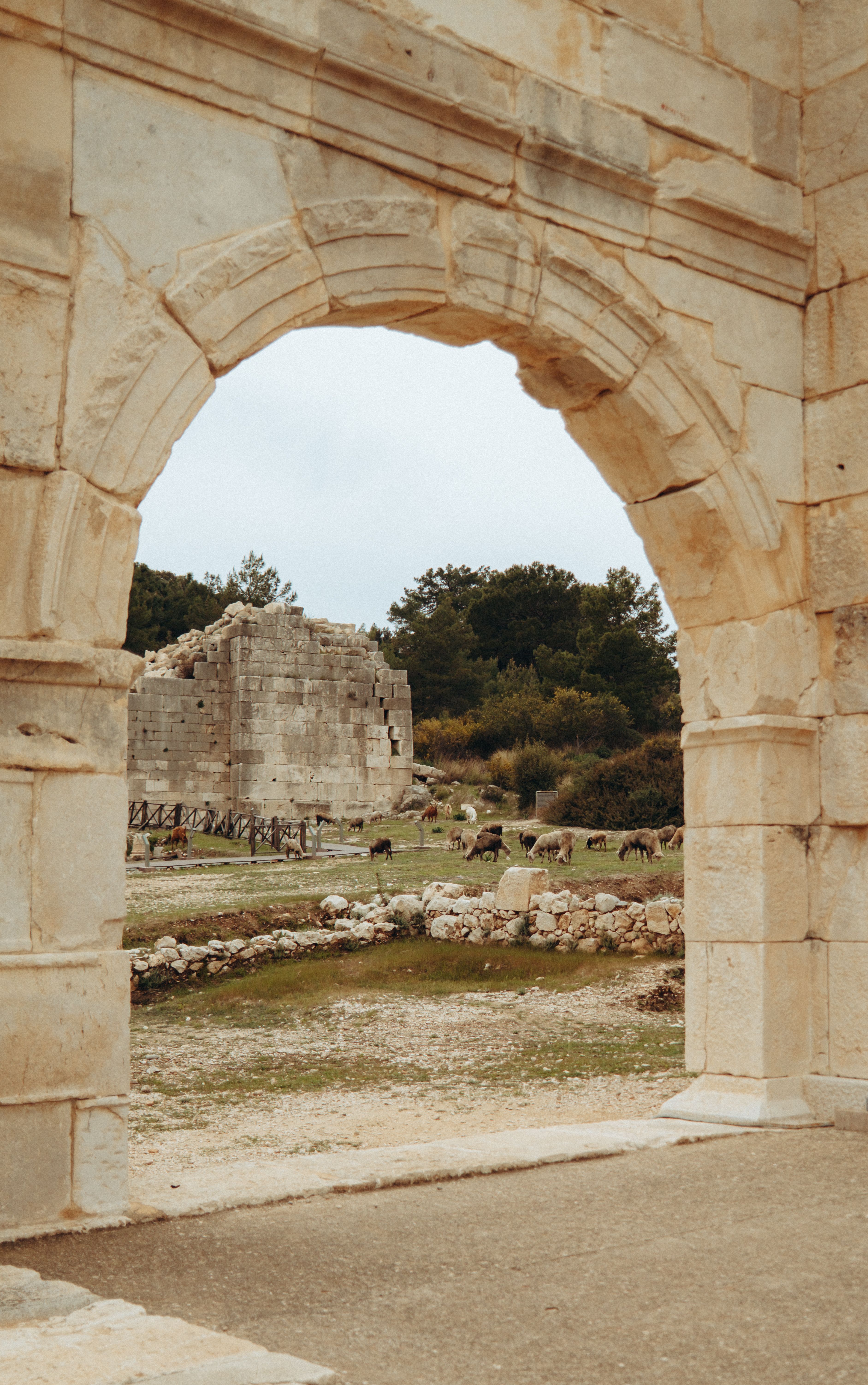 Ancient Stone Archway Leading to Ancient Ruins · Free Stock Photo