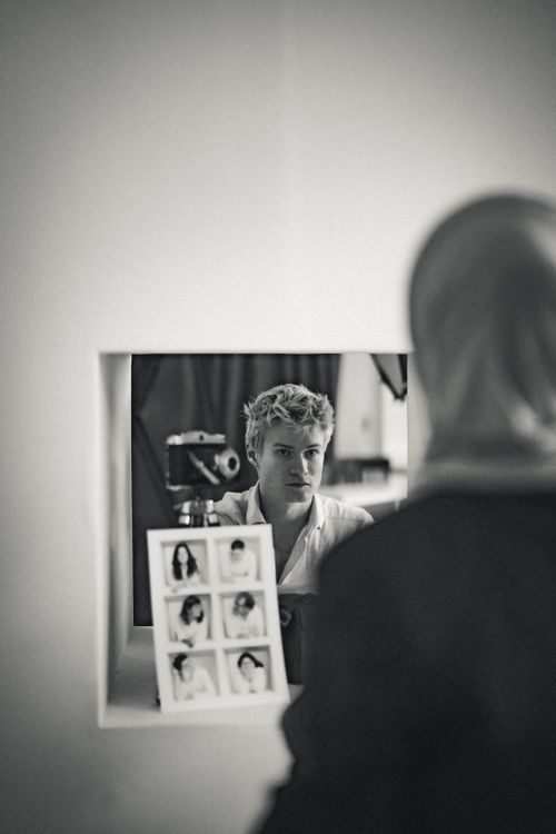 Free A reflective moment captured in a mirror with artistic black and white tones. Stock Photo