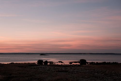 Free Serene pink sunrise at Cove Island Park in Stamford, Connecticut, USA, with tranquil water reflections. Stock Photo