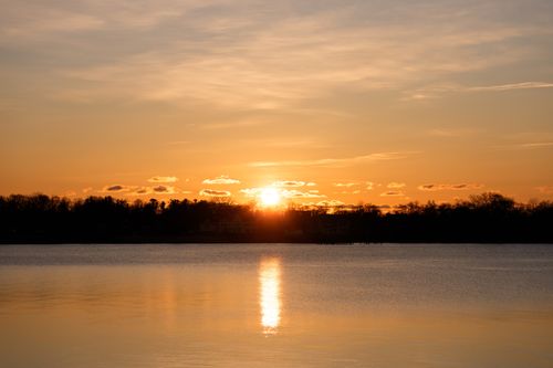 Free Serene sunrise over Cove Island Park in Stamford, Connecticut, capturing a calm morning reflection. Stock Photo