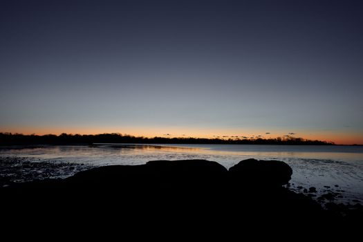 Beautiful sunrise over low tide at Cove Island Park in Stamford, CT.