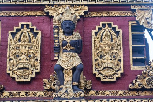 Free Detailed Balinese Hindu temple carvings showcasing traditional deities and mythical creatures. Stock Photo
