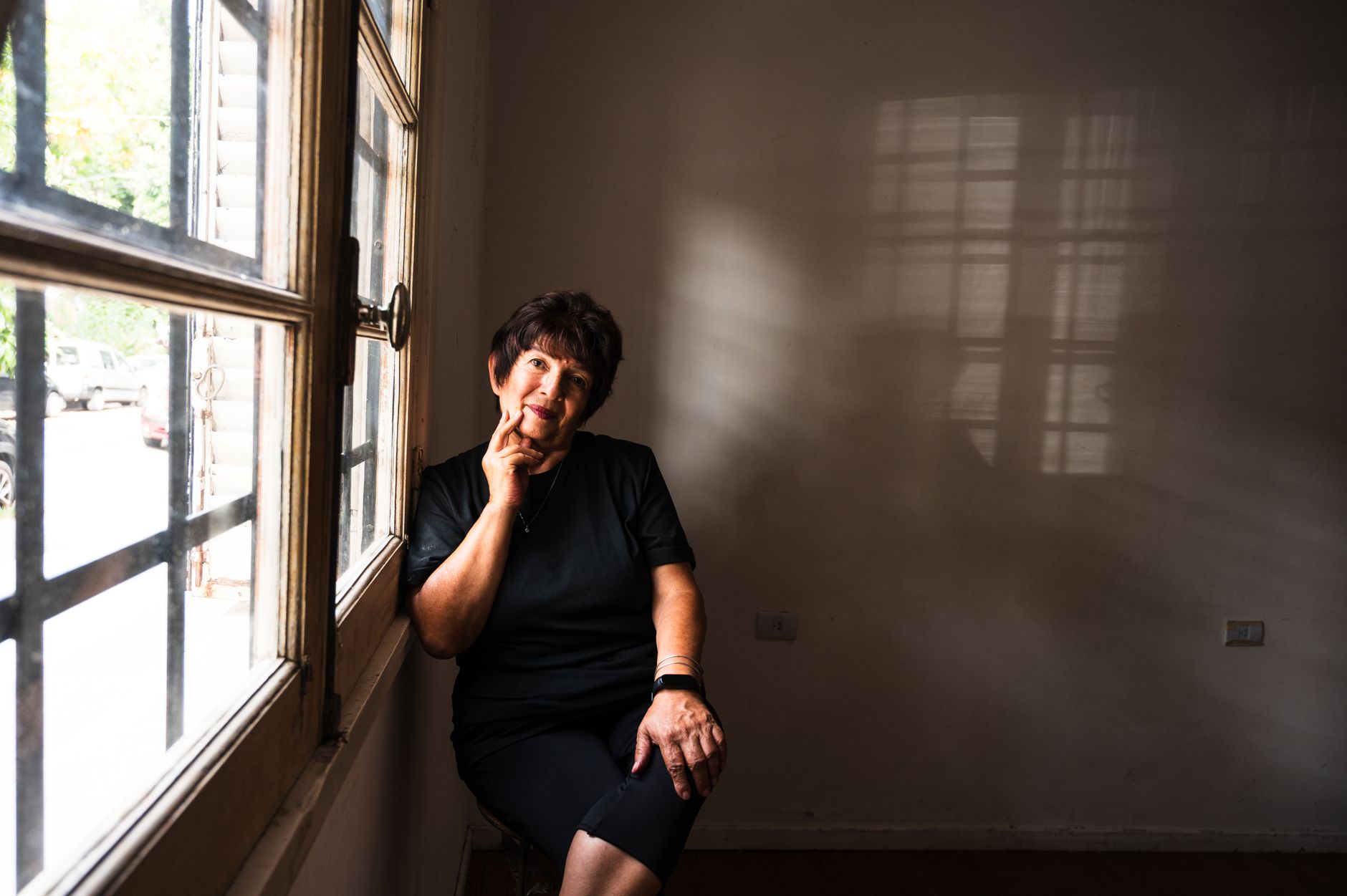 Thoughtful older woman at window in Aurora — illustrating this Medicare guide