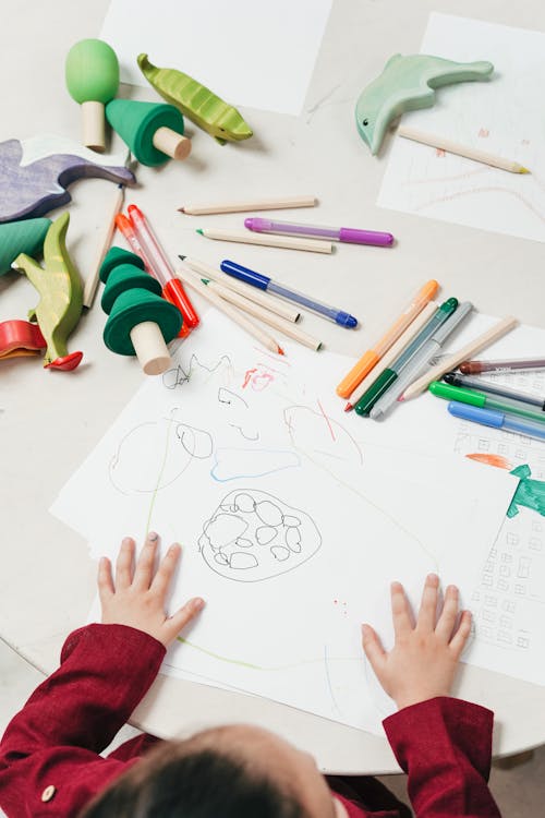 Free Kid On White Table  Painting Stock Photo