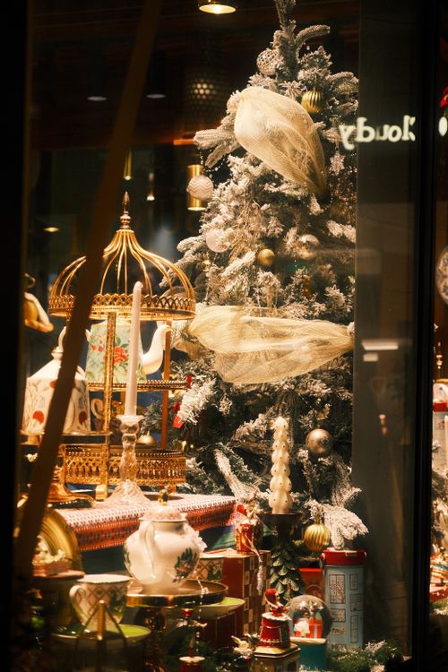 Free Festive Christmas tree and decor in a Guangzhou storefront showcasing elegance. Stock Photo