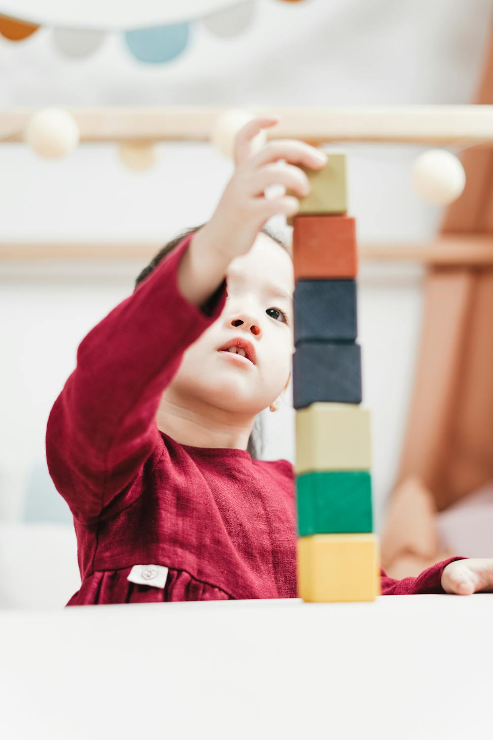 child building tower with blocks