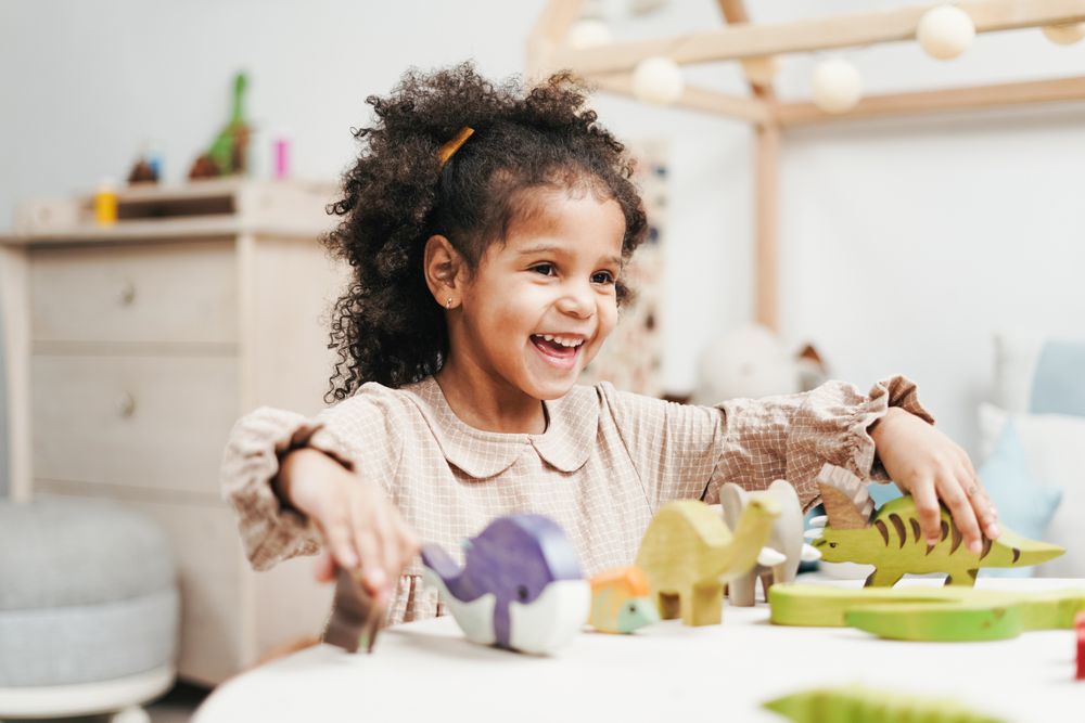 Happy child learning with wooden blocks