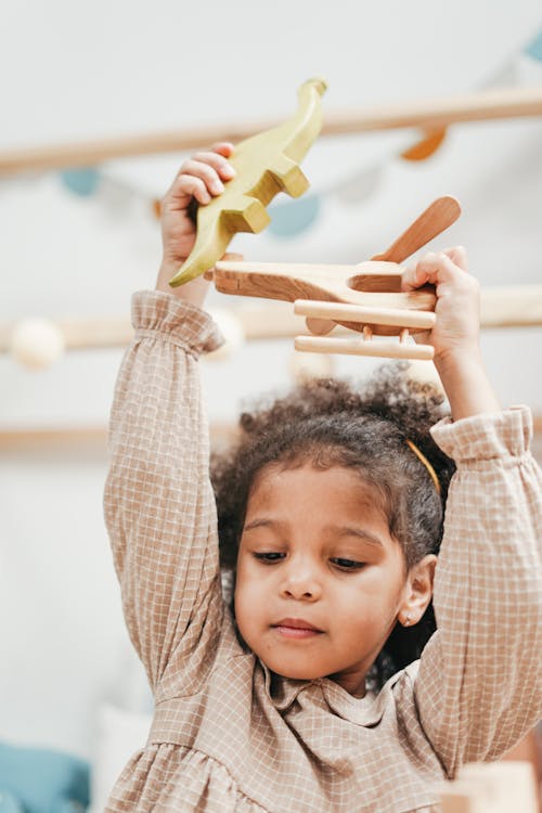 Free Young Girl Wearing A Brown Long Sleeve Dress Stock Photo