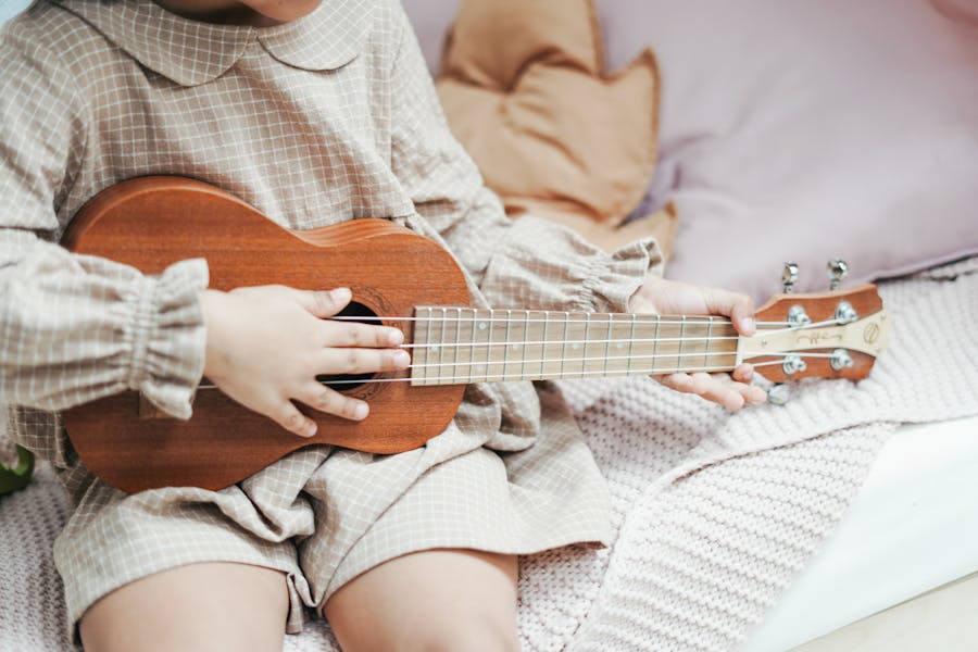Should a beginner start with ukulele or guitar?