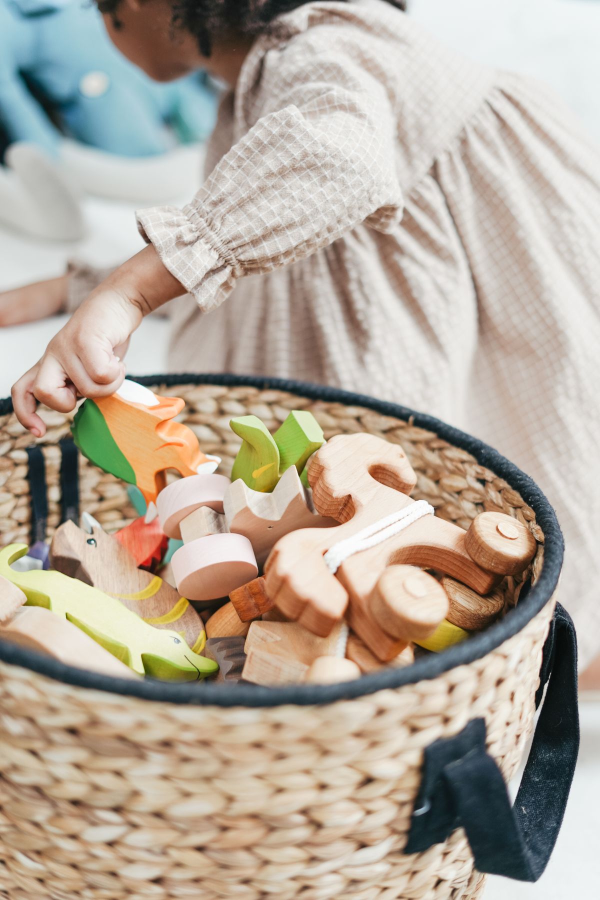 Young child exploring wooden toys