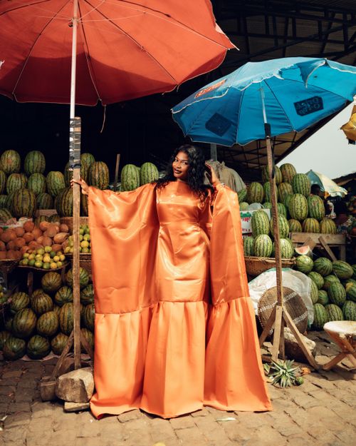 orange dress photoshoot One Orange Fluffy Dress. Endless stories   This bold orange flying dress  has lit up the island in so many unforgettable ways  each woman brought  her own glow, grace, and