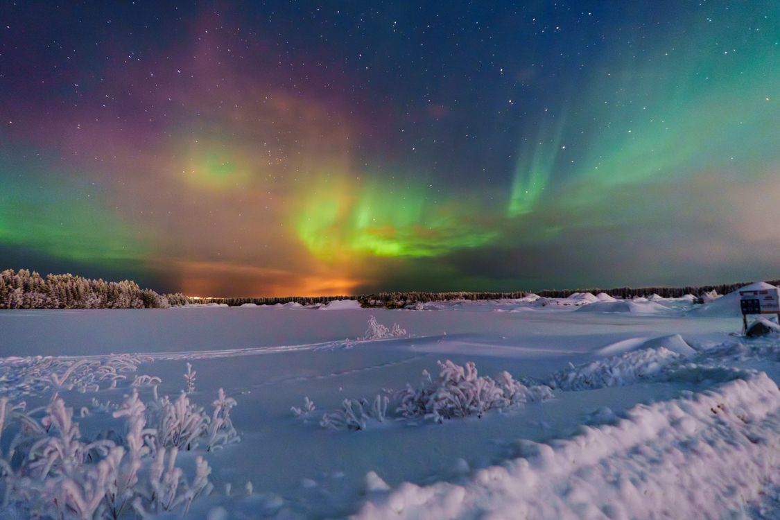 Stunning Aurora Borealis Over Winter Landscape · Free Stock Photo