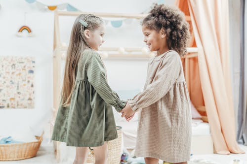 Photo of Girls Standing While Playing