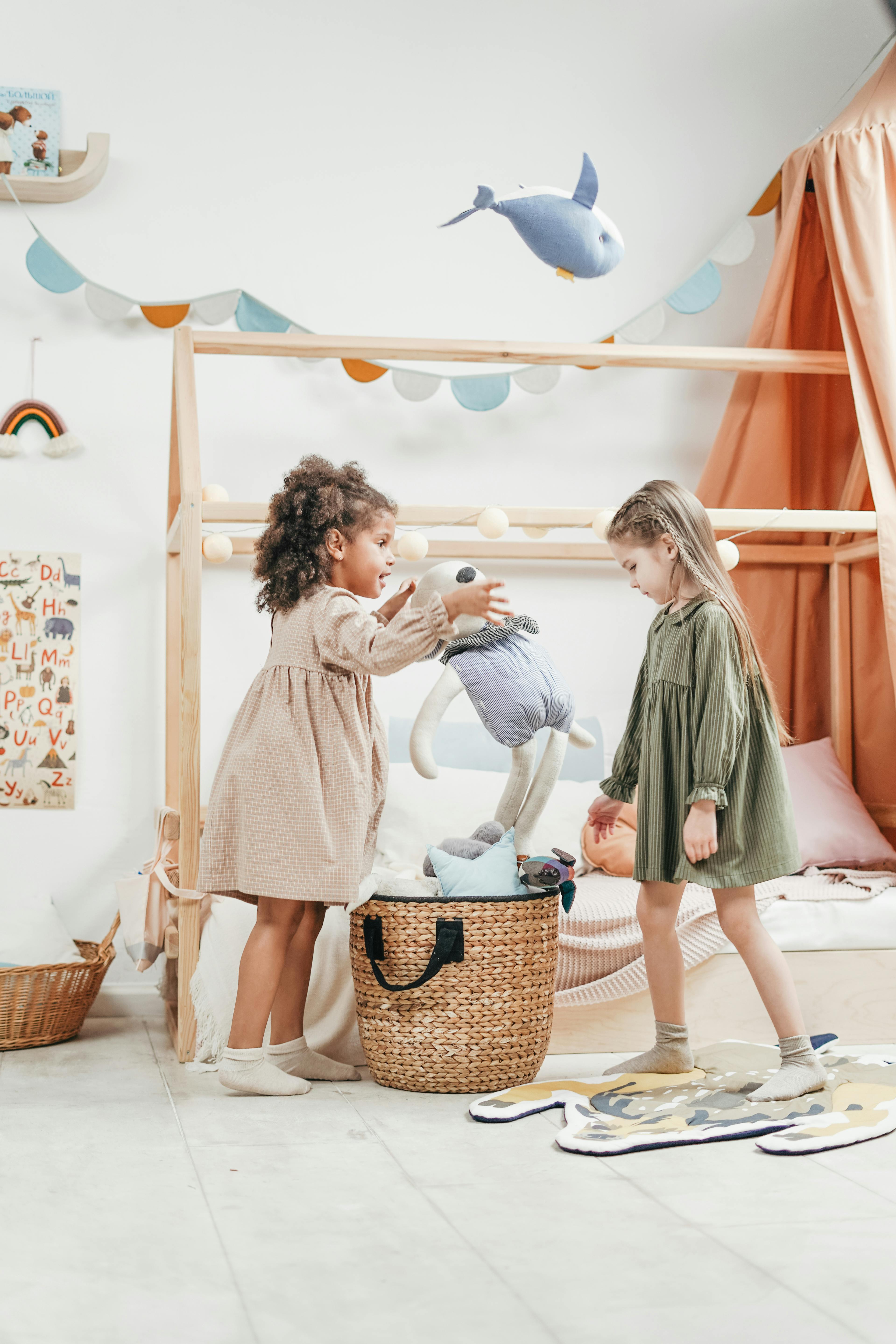 girls playing with stuffed toys