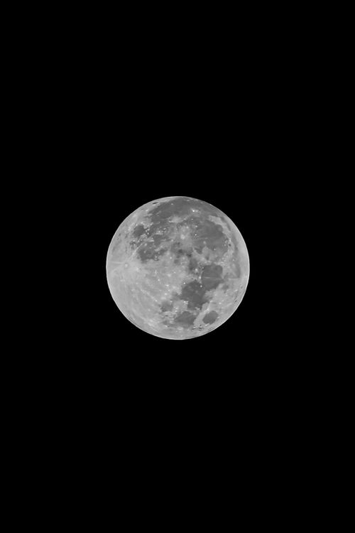 Free Stunning capture of the full moon glowing brightly against a dark night sky in Brazil. Stock Photo