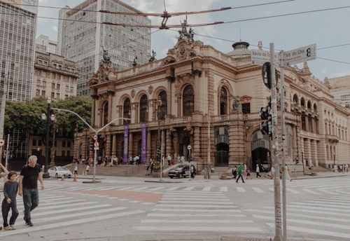 Free Street view of Municipal Theatre in São Paulo showcasing its historic architecture in a bustling urban setting. Stock Photo
