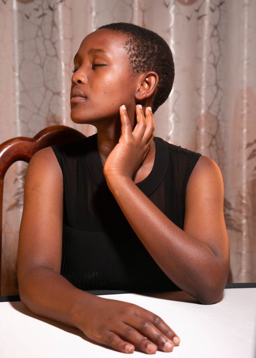 Free A serene portrait of a woman indoors, exuding calmness and introspection. Stock Photo