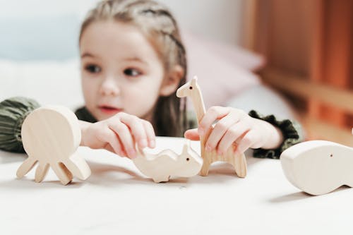 BoyGirl Holding wooden Toys