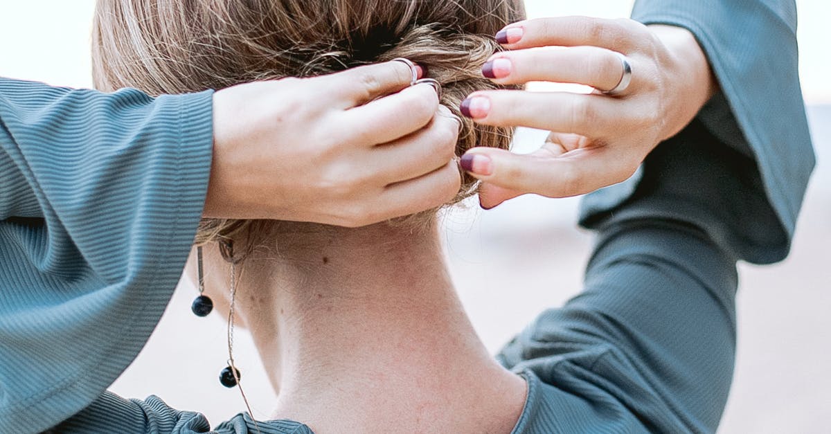 Photo of a Person Fixing Her Hair