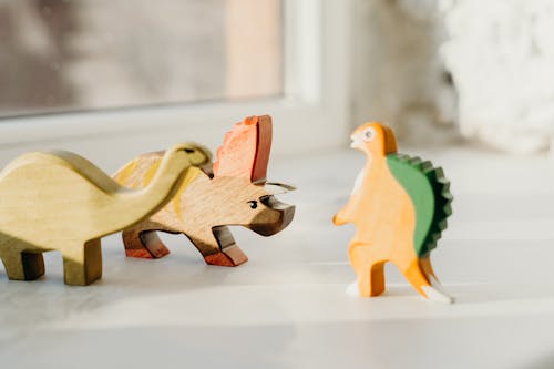 Kostnadsfri bild av barnleksaker, dinosaurie, grunda fokus