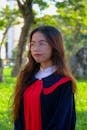Graduate in Traditional Vietnamese Robes Outdoors