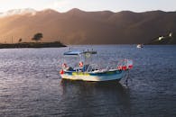 Serene Lake Landscape with Boat at Dusk