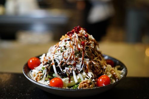 Free A fresh and colorful salad with cherry tomatoes and pomegranate seeds in a bowl. Stock Photo