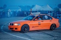 Orange Car Drifting at Night Racing Event
