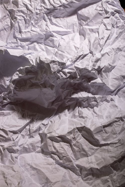 Free High-resolution image of crumpled white paper creating an abstract and textured pattern. Stock Photo