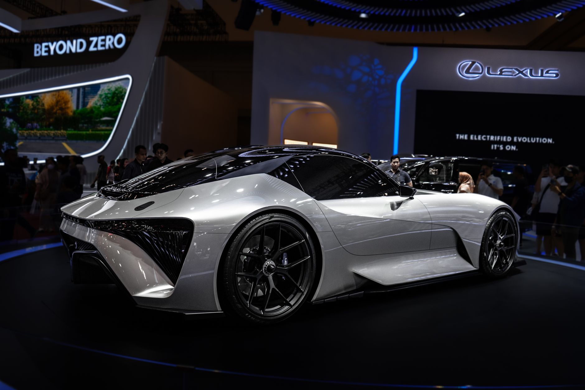 Modern electric sports car displayed at international auto show. Sleek design and futuristic features.