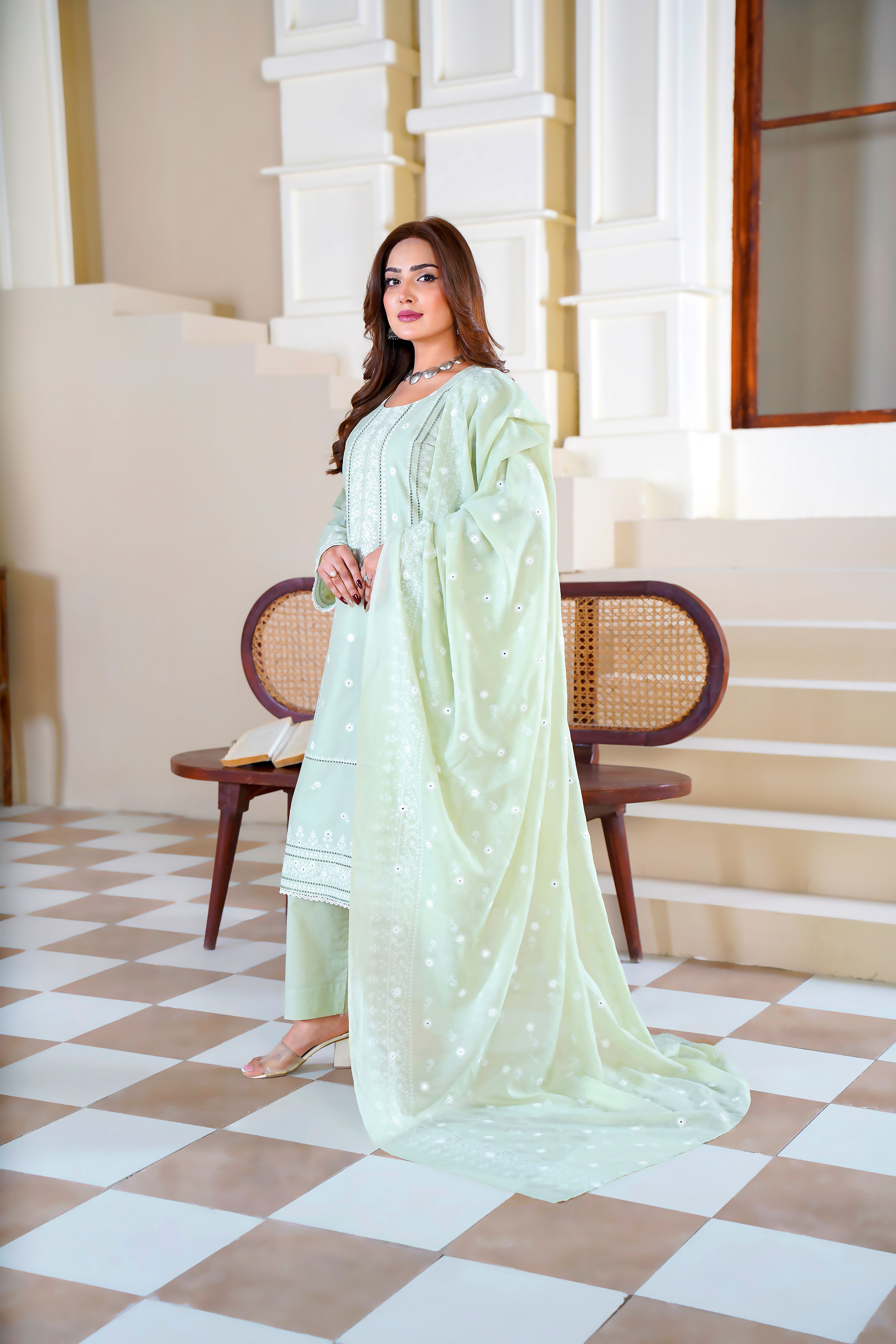Model in a light green embroidered eastern dress in Lahore