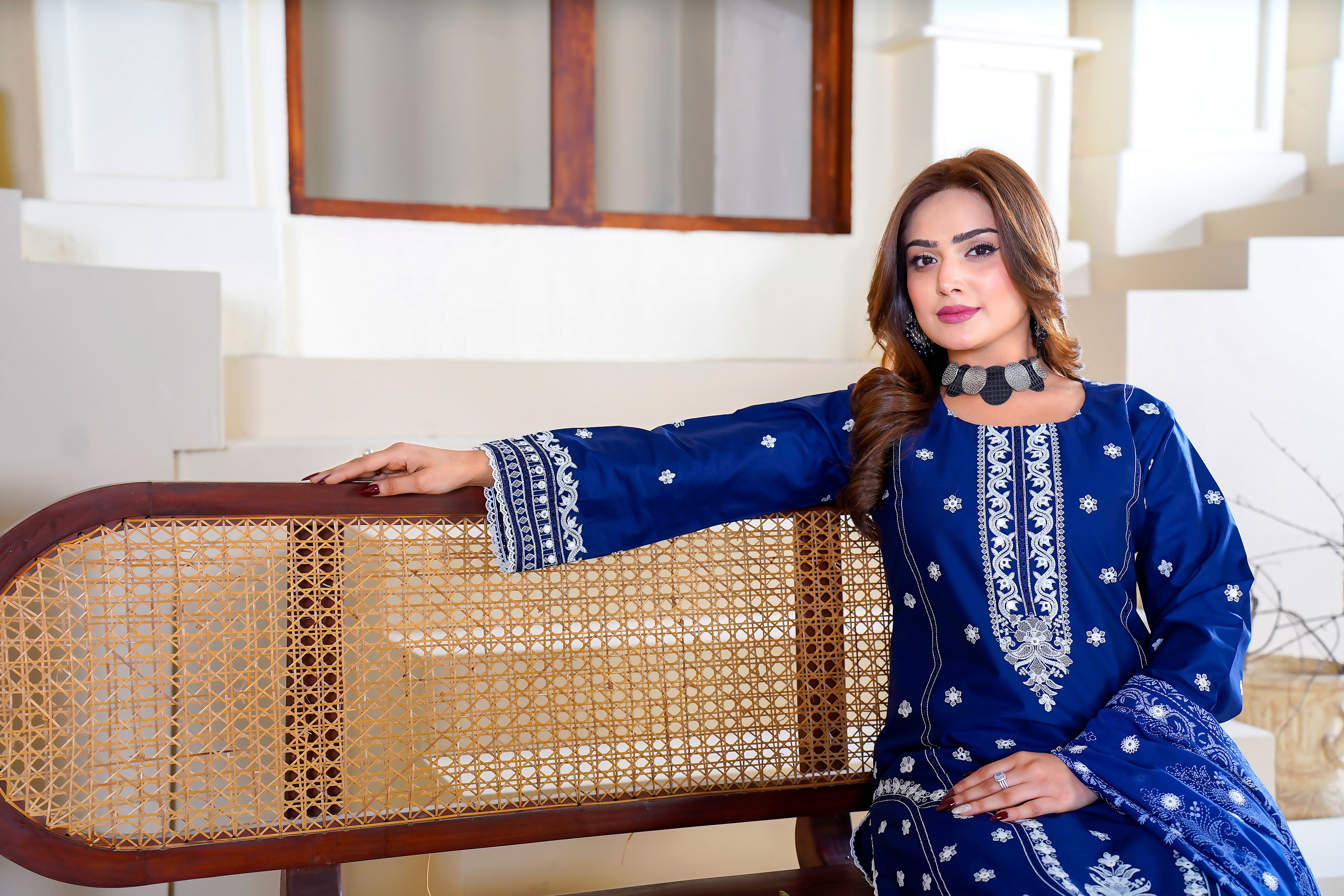 A beautifully patterned Daman embroidered cross slub digital printed lawn displayed indoors with soft natural lighting