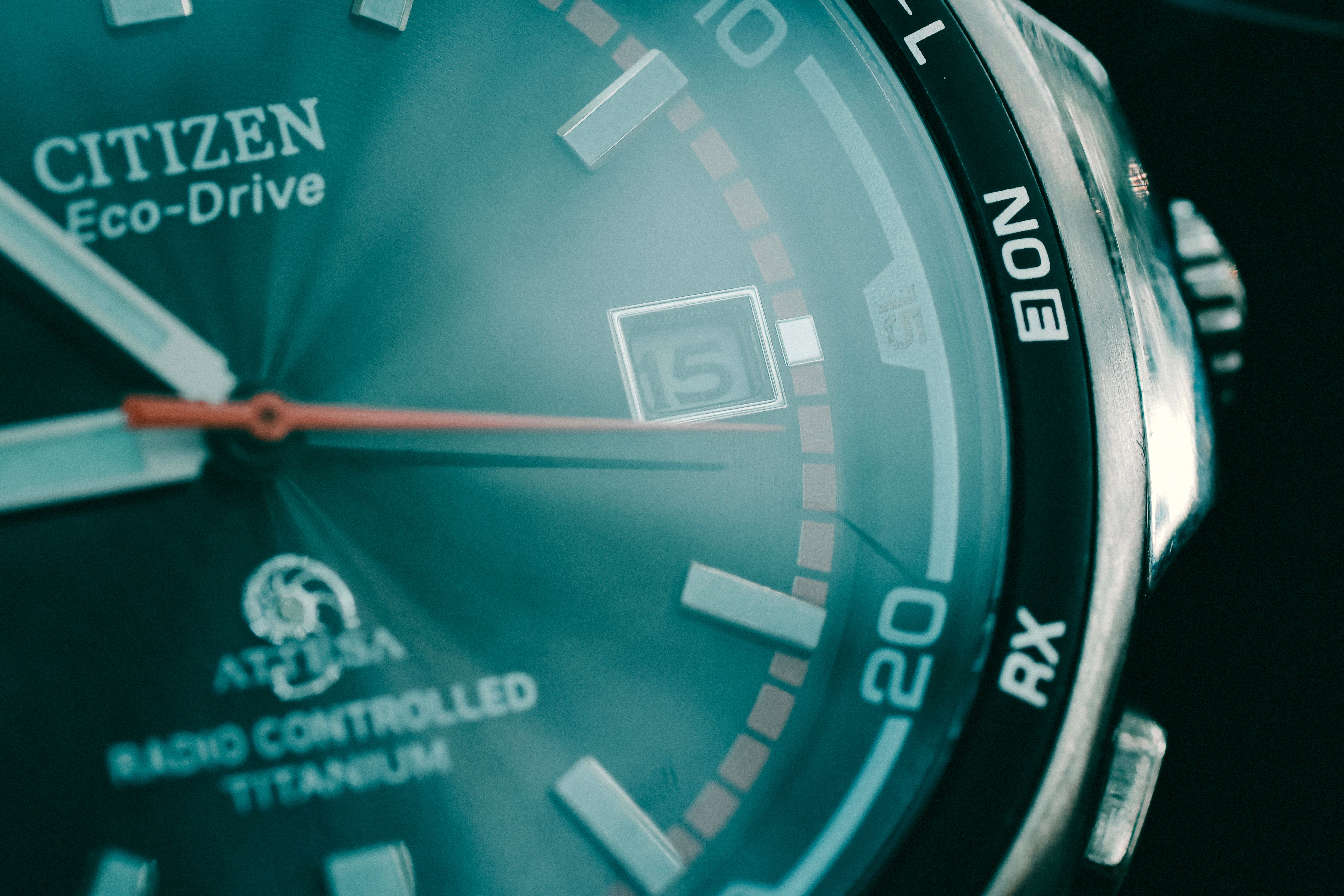 Macro shot of a Citizen Eco-Drive watch showcasing dial details and date feature.