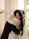 Elegant Wedding Embrace Captured in Soft Light