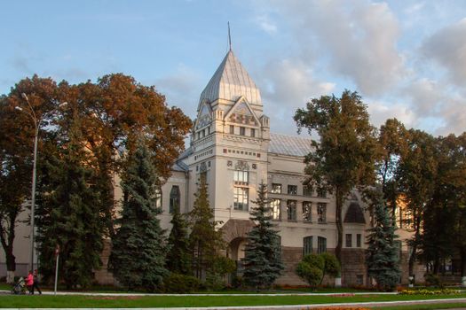 Stunning historical library in Chernihiv, Ukraine, surrounded by lush autumn foliage.