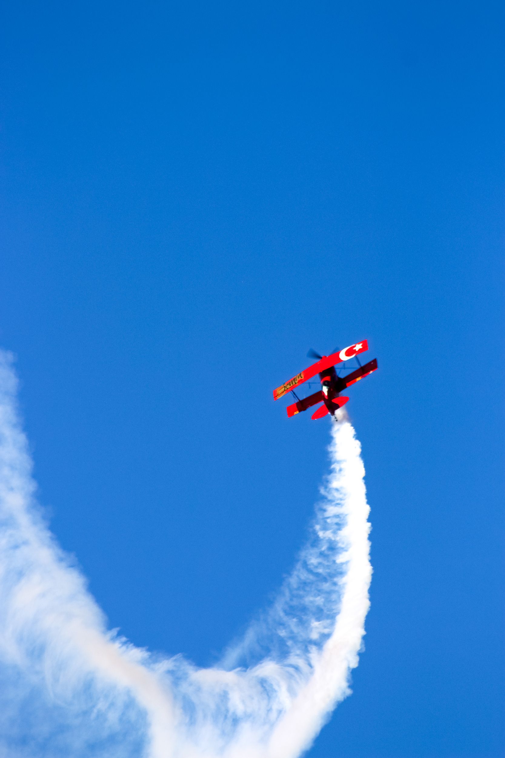 Red Biplane Sky Show with Turkish Flag in Izmir · Free Stock Photo
