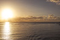 Serene Ocean Sunset with Golden Sky