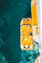 Aerial View of Yellow Lifeboat on Blue Ocean Water