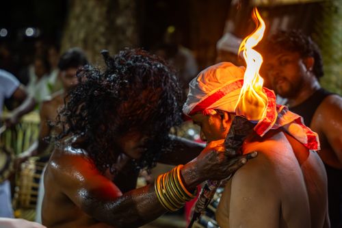 Free Captivating scene of a traditional ritual with fire during a festive night in Gampaha, Sri Lanka. Stock Photo