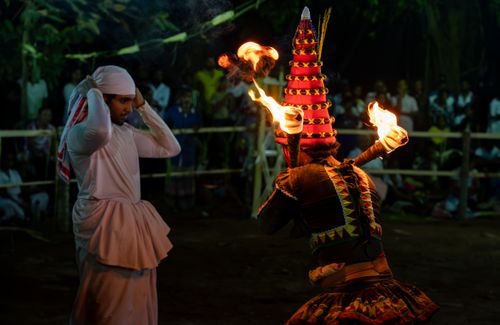 Free A vibrant traditional fire dance performed outdoors in Gampaha, Sri Lanka, captivating onlookers. Stock Photo