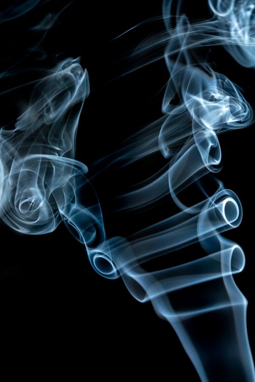 Free Captivating abstract image of swirling smoke in motion against a dark backdrop. Stock Photo