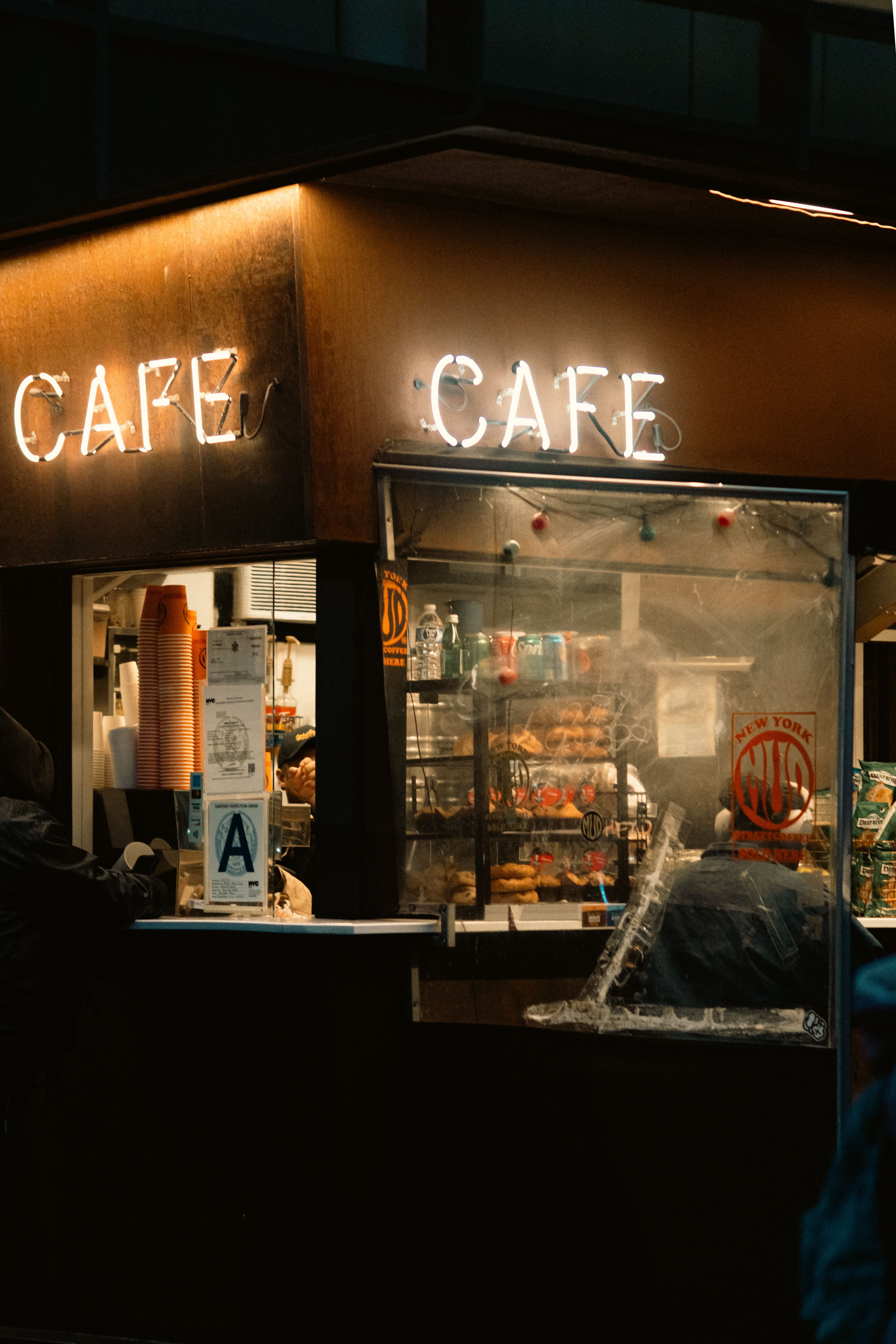 Retro red diner style bar lights flanking a vintage coffee bar counter