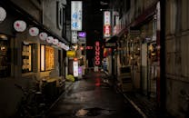 Vibrant Alley in Kyoto at Night with Neon Signs