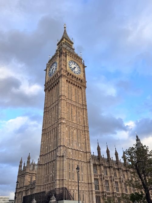 Free Big Ben clock tower in London captured with a clear view against a cloudy sky. Stock Photo