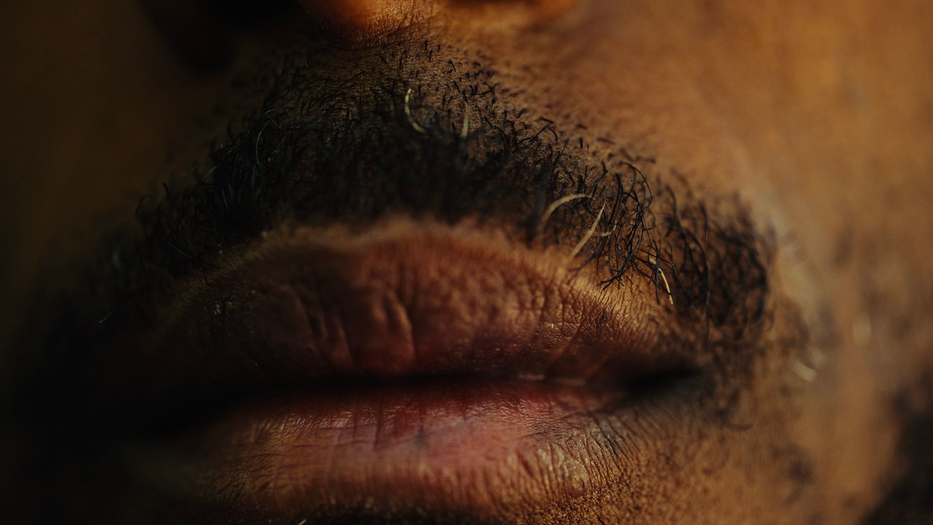 Modafinil Dry Mouth: Understanding and Managing This Side Effect Detailed close-up of a man's lips and mustache with a focus on texture — modafinil dry mouth