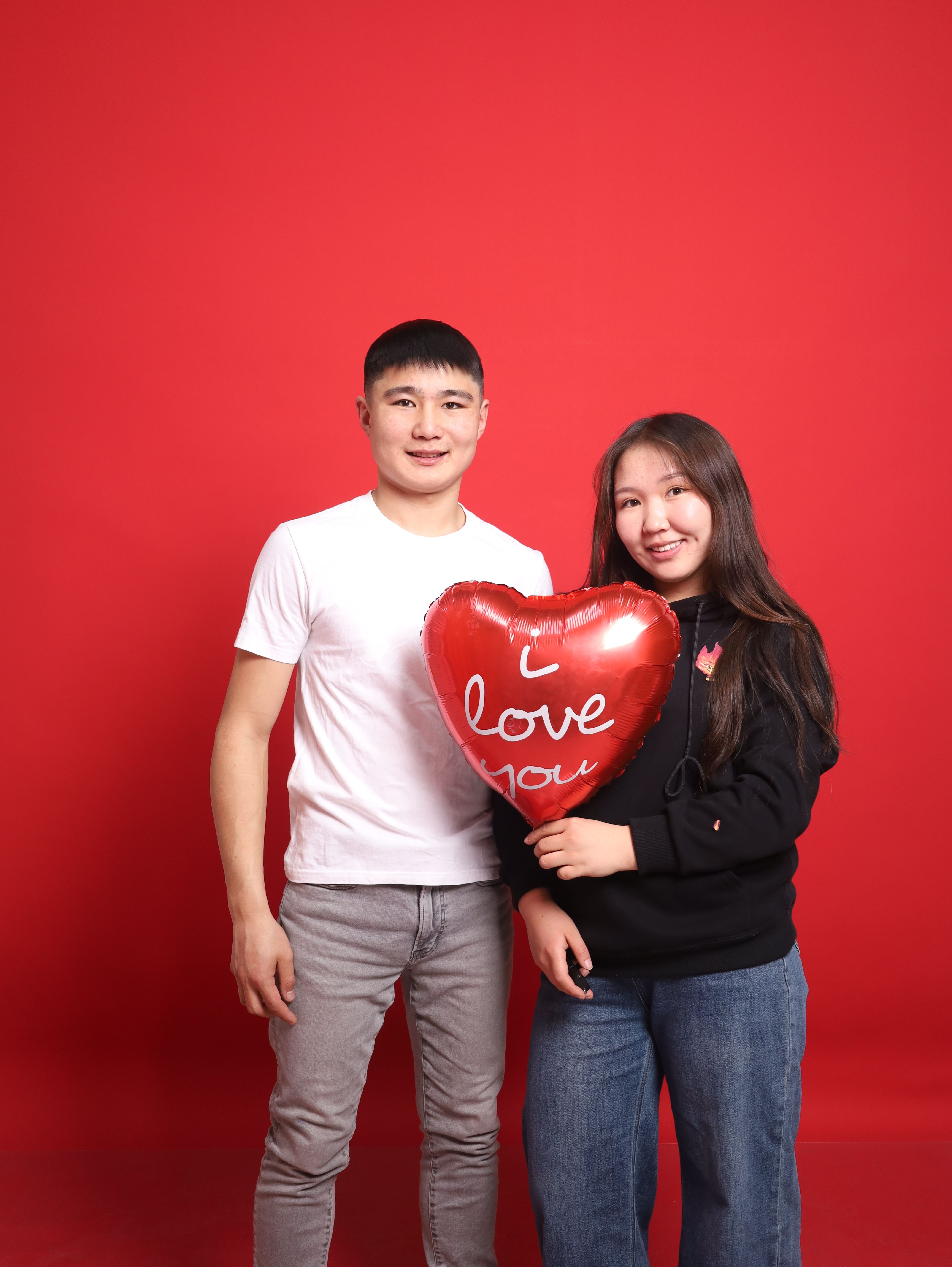 Romantic Couple with Heart Balloon on Red · Free Stock Photo