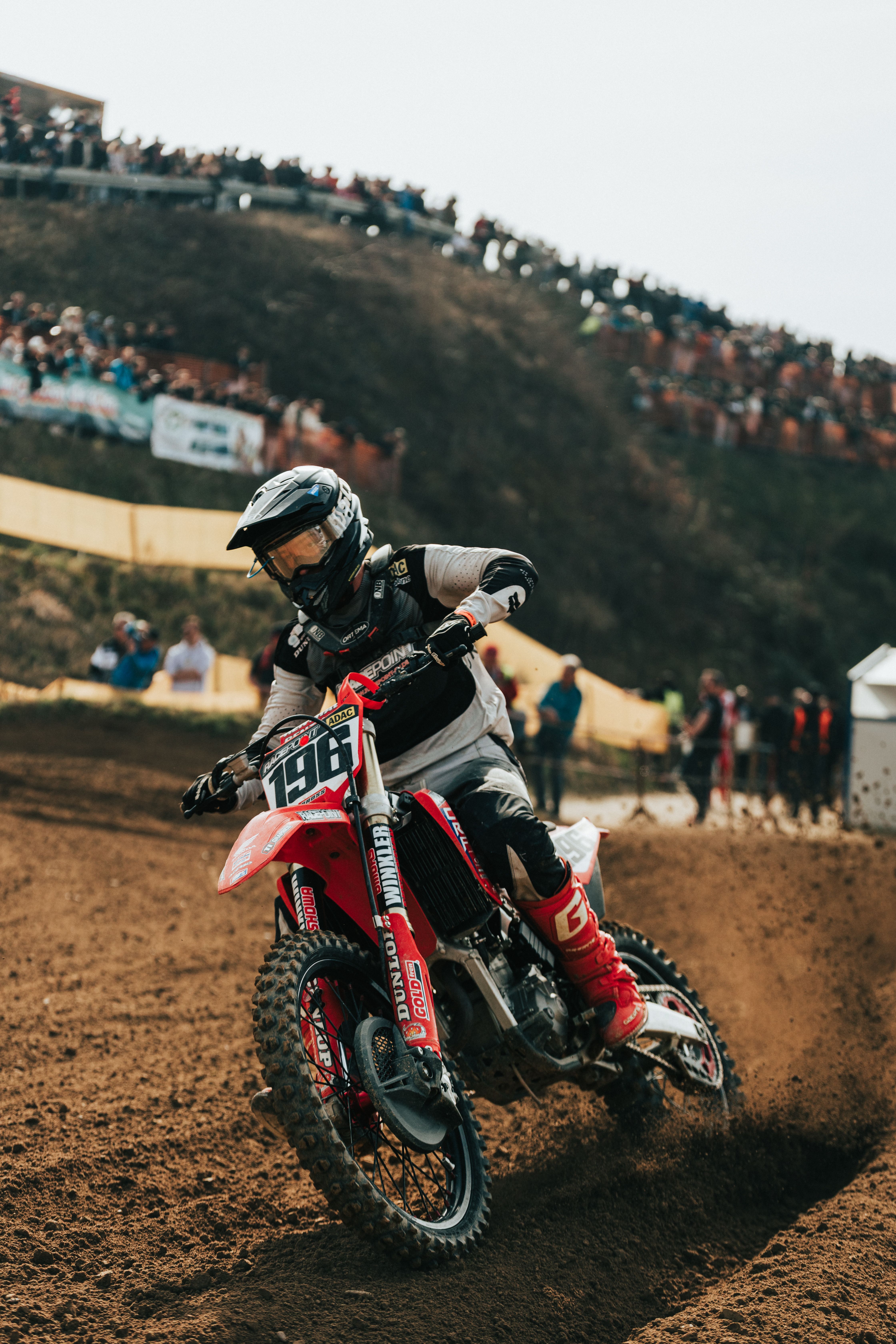 Motocross Rider Racing on Dirt Track · Free Stock Photo