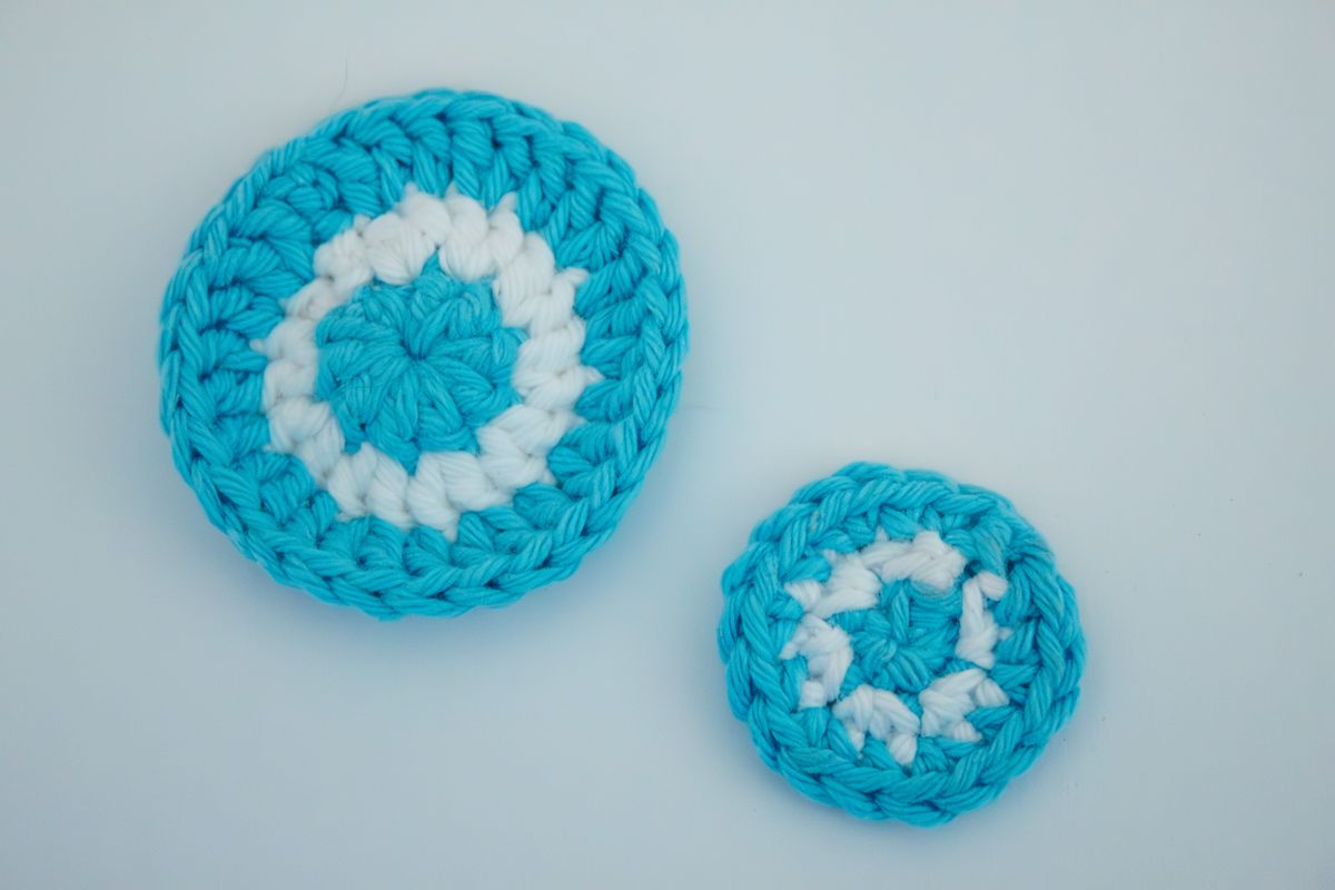 Yarn craft ideas with a set of round blue and white yarn coasters