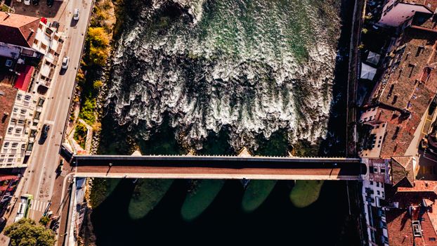 A stunning aerial capture of Ponte della Vittoria crossing the Adige River in Verona, Italy.